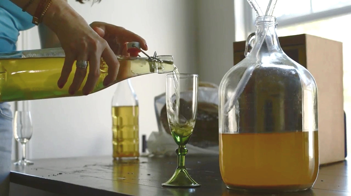 Pouring home made mead into a glass
